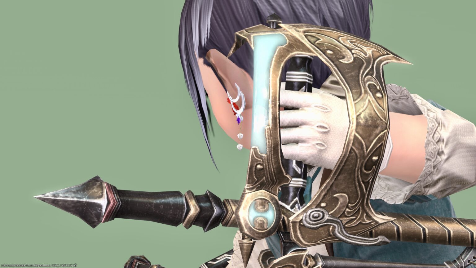 Golden Tonfa monk weapon that shines in turquoise color “Classical